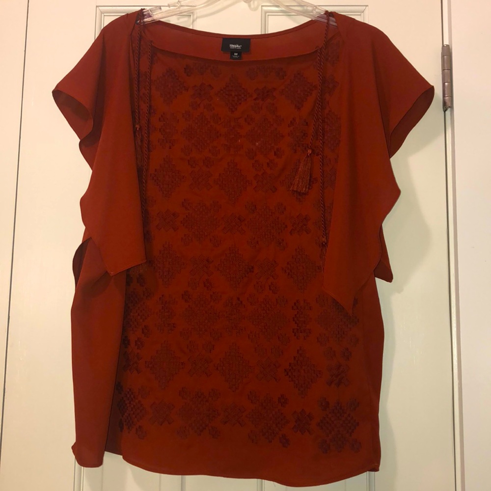 Burnt orange shirt!